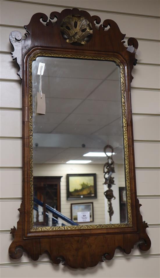 A near pair of walnut fret cut wall mirrors H.89cm